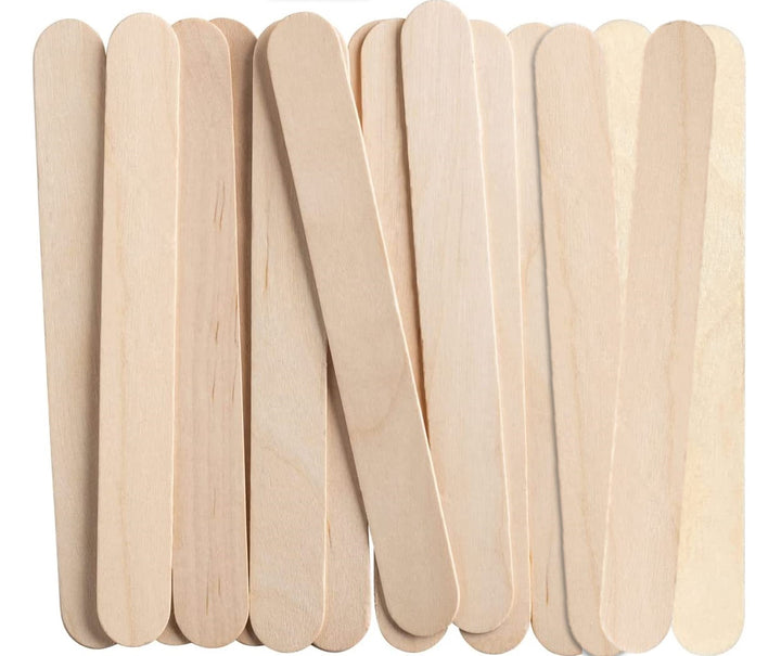Close-up of flat wooden tongue depressors with rounded ends